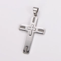 Detail shot of silver stainless steel cross pendant with Greek key pattern and relief cross - Large / No Chain / Steel