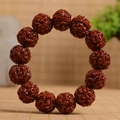 Deep red-brown Rudraksha beaded bracelet with natural honeycomb texture on bamboo mat - Machine-brushed Jade Finish 19-20mm (No Spare Beads)