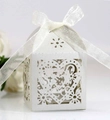 Detail showing white laser-cut heart pattern gift box with white ribbon bow - Silver
