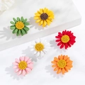 Detail showing set of six 3D daisy flower brooches in vibrant matte resin colors - Daisy 6-Piece Set