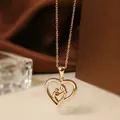 Rose gold titanium steel heart necklace with mother and child silhouette and zircon stones - Rose Gold Heart Necklace N0452R