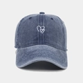Detail of double heart embroidery on washed denim fabric of a vintage baseball cap - Adjustable / Navy Blue