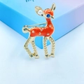 Orange enamel deer brooch with blue gemstone eye and white pearl on gradient box - Cute Fawn