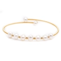 Detail of elegant gold wire-wrapped cuff bracelet with seven white freshwater pearls - Nine White Pearl Open Style (ZZ-0016)