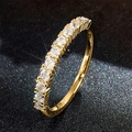 Macro view of gold plated eternity ring with round white zircon stones in prong setting - US 7 / Style T0513/Prong Setting / Gold