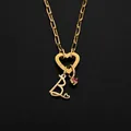 Gold stainless steel necklace featuring a heart-shaped clasp and a letter B pendant accessory - Gold / Letter B