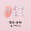 Detailed view of silver alloy bow nail charm with a heart-shaped crystal on pink background - Silver Bow + Starry Pink Stone (9976)