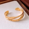 Detail of 18K gold-plated irregular double-layer open bangle with liquid metal texture - Gold