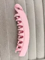 Detailed view of large pink matte banana hair clip with interlocking teeth for ponytails - Matte Pink