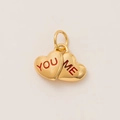 Close-up of gold double heart pendant with red engraved YOU and ME text details - Single Pendant (No Chain) / Heart - Engraved
