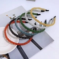 Five assorted braided beaded headbands in multi colors on a minimalist white desk - 6-Piece Set 33#