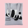 Light gray knitted tote bag with Giant Panda pattern and woven text in a flat lay view - Lying Panda Grey