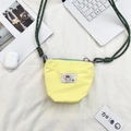Yellow canvas crossbody bag with rainbow patch and green-red woven strap for women - Yellow