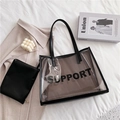 Transparent black PVC tote bag with inner pouch and SUPPORT text in casual lifestyle setting - Coffee