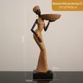 African resin figurine in ocher yellow dress holding a plate with woven texture detail - BYX8639 Style D Woven African Woman