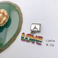 Macro shot of stainless steel rainbow LOVE charm with enamel finish for bracelets - Model 131-Rainbow LOVE