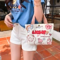 Cartoon sheep and peach canvas handbag with bright orange handles in a sunny outdoor setting - Rainbow Sheep