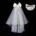 Detail of white bridal veil with silk bow and metal hair clip for secure wedding styling - Plain Tulle Veil (Approx. 50cm - Hair Clip Style) / White