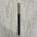 Black handle makeup brush with white bristles for eye shadow on wood background - Plastic Handle 370 Concealer Brush