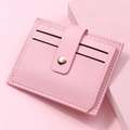 Detail of pink PU leather card holder showing soft texture and gold snap closure - Light Pink