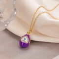 Detailed close-up of 18K gold plated evil eye pendant with purple enamel and zircon - Purple