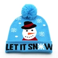 Close-up of light blue Christmas knit beanie featuring snowman and Let It Snow text - Snowman and LET IT SNOW Style