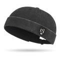 Faded vintage black docker cap with a stylish R-letter shield patch detail - Adjustable / Black