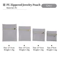 Bolsas de joyería en cuero PU gris de cuatro tamaños con cremallera dorada elegante - 8*8cm / Gris