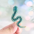 Exquisite gold-plated snake brooch adorned with shimmering blue crystals and rhinestones - Lake Blue