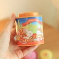 Mini bunny tea tin metal box featuring orange lid and cute rabbit picnic illustration - Baking Orange