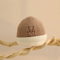 Detailed view of the embroidered bear and Didicute text on a ribbed knit baby beanie - One Size (6 Months-2 Years) / Khaki