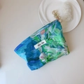 Top view of blue and green floral liberty print makeup bag on a minimalist white background - Ocean Blue Large Floral