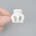 Mini white pumpkin hair claw clip in matte resin held by hand for scale display - 3.5cm / White
