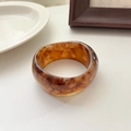 Wide amber resin bangle with retro tortoiseshell marble texture and minimalist design - Red Coffee