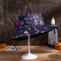 Close-up of Halloween bucket hat featuring skulls, bats, and magic potion prints - M (56-58cm) / Bat Mushroom Flame