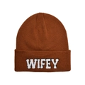 Detail of brown knitted beanie featuring white WIFEY embroidered patch on cuff - One Size / Caramel color