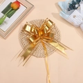 Macro view of a large gold matte metallic organza bow for Christmas gift wrapping and decor - Gold