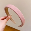 Pink woven headband with a wide padded design and non-slip lining for hair styling - Pink