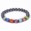 Macro detail of elastic bead bracelet with colorful square stones and metallic beads - Hematite