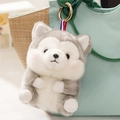 Cute gray and white husky plush keychain with tricolor ribbon on a handbag - Husky