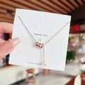 Collana in titanio oro rosa con pendente a cilindro con numeri romani e cristalli - Stile cilindro con numeri romani (X235) / Oro rosa