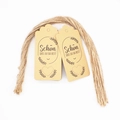 Detail of kraft paper gift tags with German text and natural jute rope on white background - 12-German Schon