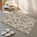 Thick chenille bath mat featuring a beige and brown geometric triangle pattern design - Plain Weave Block