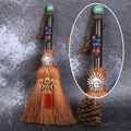 Detail of handcrafted witch broom with natural crystals and pentagram metal charm - Green Aventurine