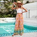 Bohemian floral wide leg trousers in orange and purple tones for casual summer resort wear - S / Orange