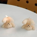 Set of two white creative bear shaped candles showing unlit and burning states - White