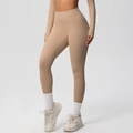 Detail of high-waist yoga leggings in nude beige with wide tummy control waistband - Medium Khaki