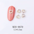 Close-up of 5.5mm golden heart alloy nail art charms with iridescent rhinestones - Gold Hollow Heart Aurora Rhinestone (8879)