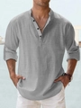 Detail of grey linen shirt texture and button collar on model with seaside background - S / Tops / Gray