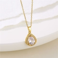 Macro shot of gold teardrop pendant with large center zircon and pave diamond border - Water Drop